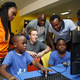 Zuckerberg watching on at a Cc Hub session of a summer coding camp for kids.